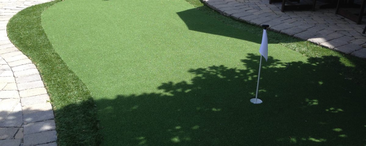 Pool-side golf green equals fun backyard