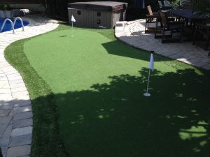 Pool-side golf green equals fun backyard